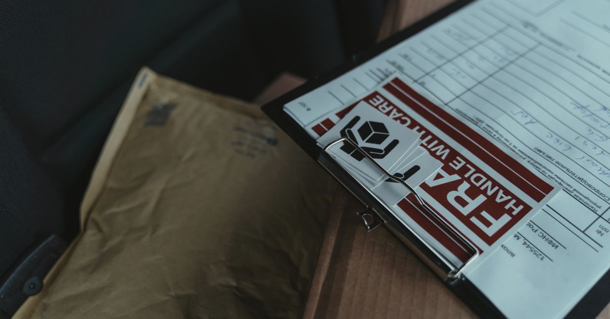 A detailed view of postal packages and delivery paperwork inside a van, emphasizing logistics.